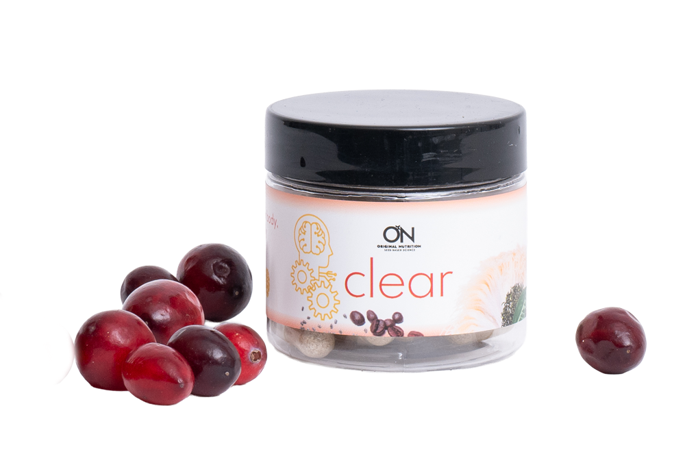 Jar labeled 'clear' with cranberries on a white background