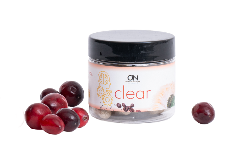 Jar labeled 'clear' with cranberries on a white background