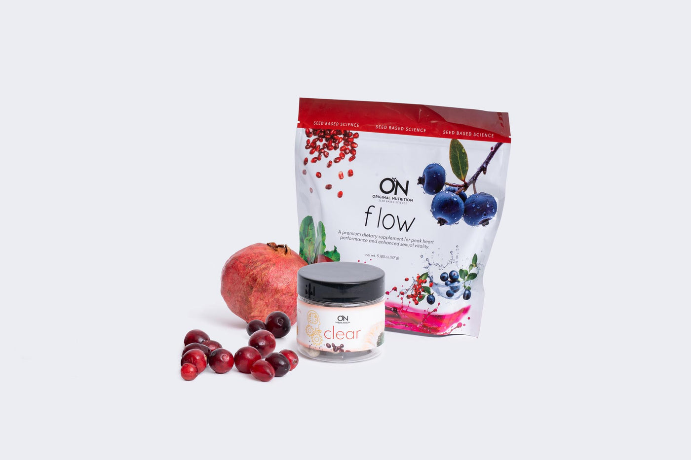 Product packaging with a jar and pomegranate on a white background