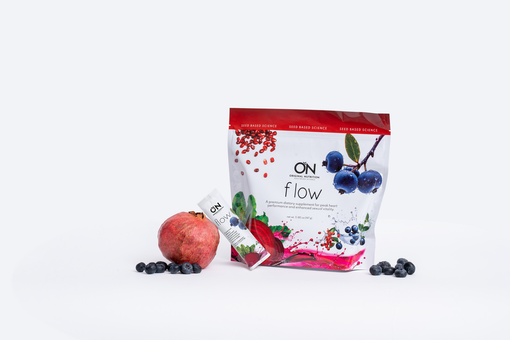 On Flow sports drink mix package with a pomegranate and blueberry on a white background