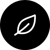 White leaf icon on a black circular background