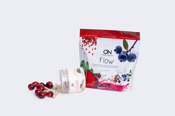 Onnit Flow supplement packaging with berries on a white background