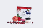 Supplement package with 'On Flow' and 'On Clear' containers, surrounded by fruits and berries on a white background.