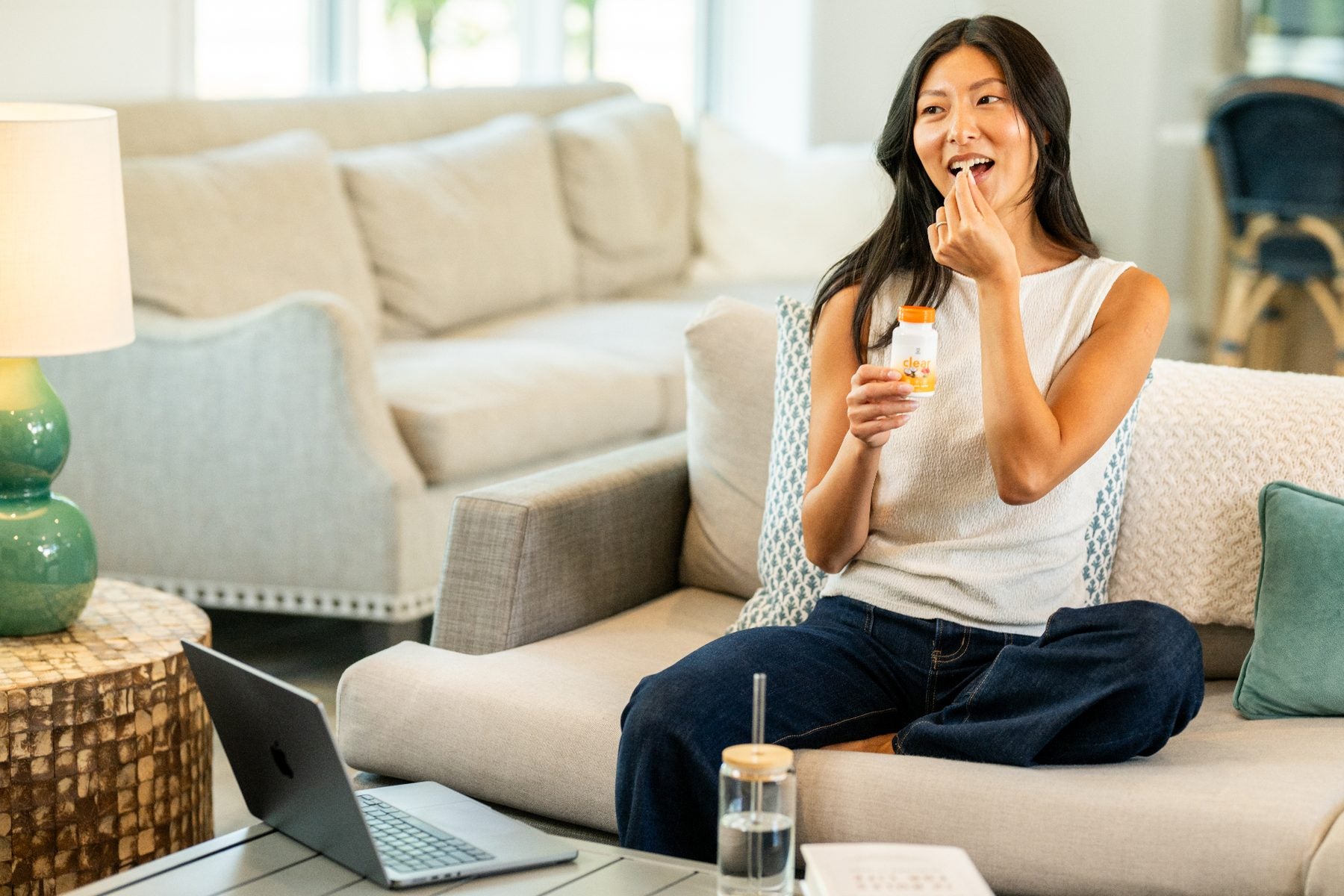 Woman on couch with CLEAR